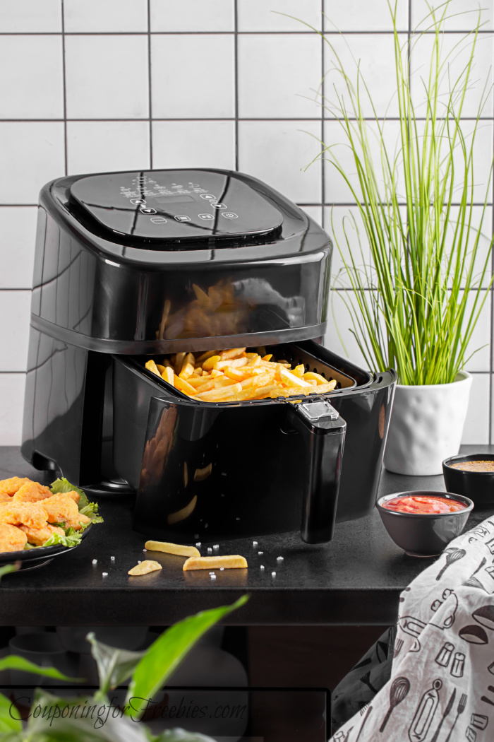 Air fryer with fries in basket