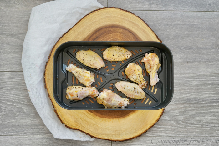 Raw wings on air fryer tray